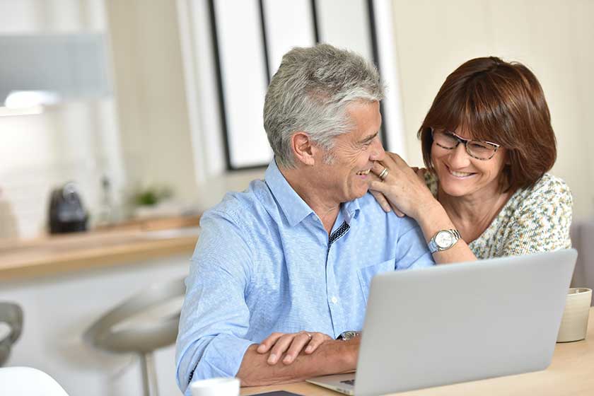 Couple using laptop computer